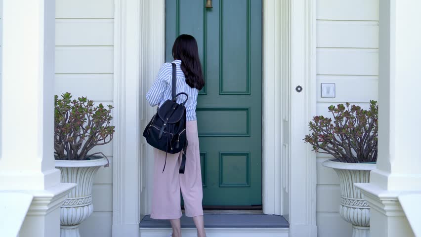 asian woman leaving home to work and locking door of apartment. white house with green front door; traditional house design. security safety lock concept. Royalty-Free Stock Footage #1020640957