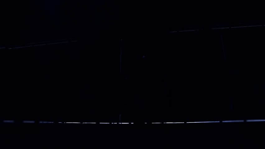 Sunlight Breaking Through Hangar Doors Over Fighter Aircraft