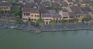 Aerial view of Hoi An old town or Hoian ancient town. Royalty high-quality free stock video footage top view of Hoai river and boat traffic Hoi An city. Hoi An is one of the most popular destinations 