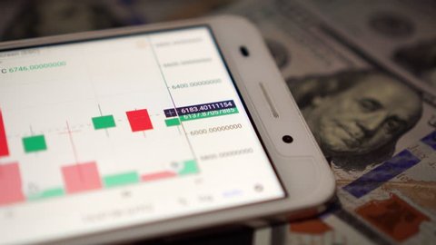 trading online on the stock exchange using a smartphone.