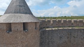 Close aerial view of medieval defense tower with loopholes