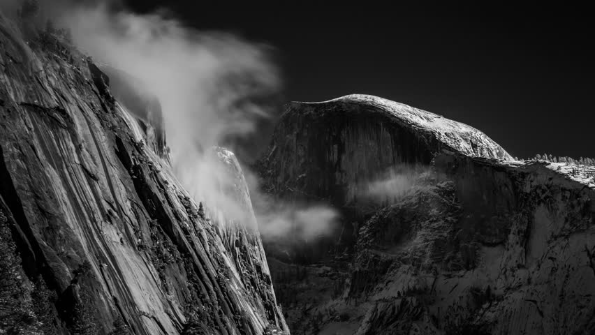 Black and white Time lapse of Half Dome and mist in winter. 