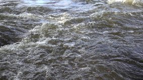 Strong water stream at the river rapids, closeup, slow motion 240 fps. Full HD stock video footage