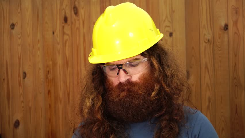 Long haired bearded man construction worker give A ok hand symbol Royalty-Free Stock Footage #1020669127