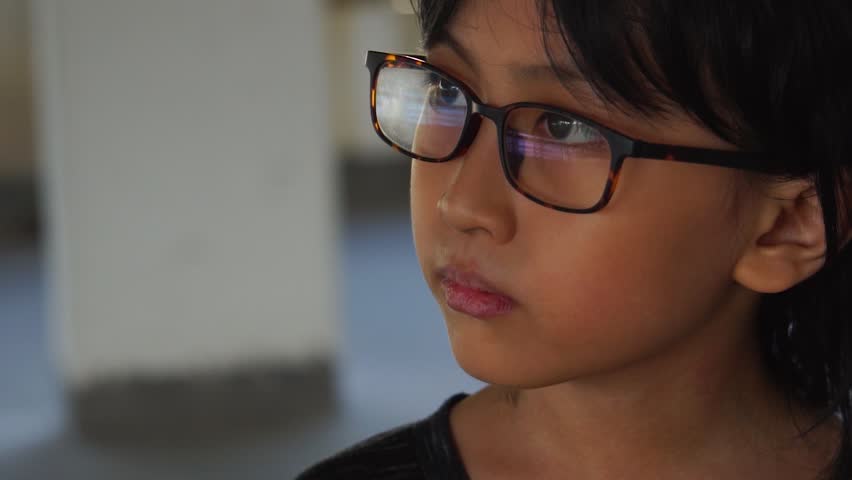 Slow Motion, extreme close up of boy in glasses stoic Royalty-Free Stock Footage #1020669580