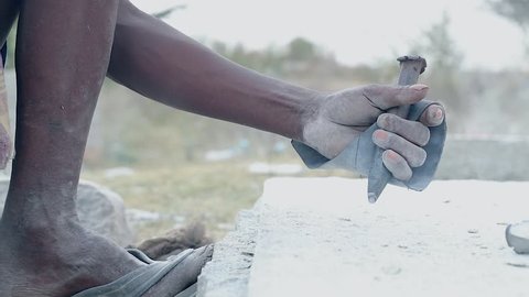 Indian Man Chiseling Stone with Hand Tools