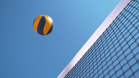 SLOW MOTION, CLOSE UP, LOW ANGLE: Unknown beach volleyball player smashes the ball past the blocker's arms and hands. Cool shot of unknown athletic people playing volleyball on a sunny summer day. - Powered by Shutterstock - Get 15% off with code: PIKWIZARD15
