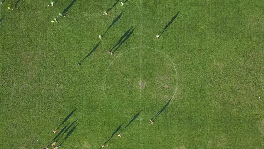 Aerial footage of football club training. Drone video of kids practise soccer