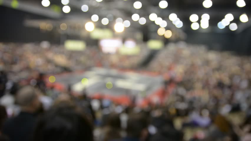 unfocused concert hall. concert hall seats dark night light rays inside exhibition fair blurred mooving camera 