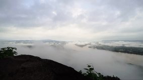 time laps of mist over the cross river from mountain 