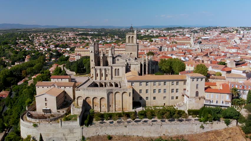 Flying towards a medieval cathedral in France | Shutterstock HD Video #1020696061