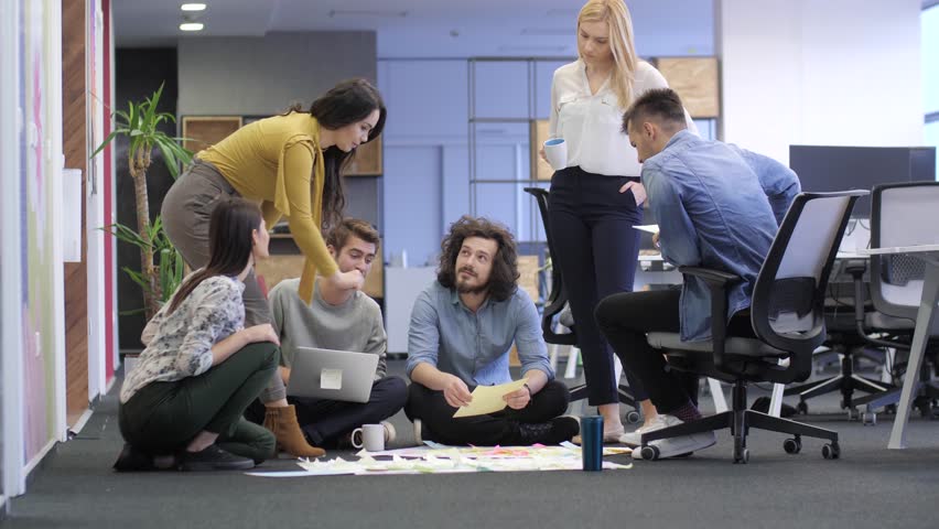 Startup business people group discussing about their project. Tech office, tech company, tech startup, tech team. | Shutterstock HD Video #1020715414