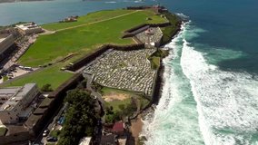 Aerial shot of Old San Juan, Puerto Rico through El Morro, cemetery and La Perla