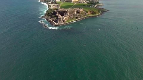 Beautiful Aerial shot coming in from ocean to El Morro in Old San Juan, PR
