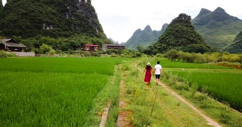 Couple enjoying the Yangshuo villages scenery aerial footage