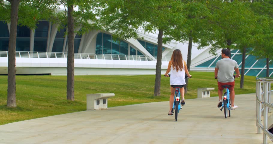 Couple Biking To to Milwaukee Art Museum