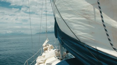 Sailboat, raising the genoa sail.