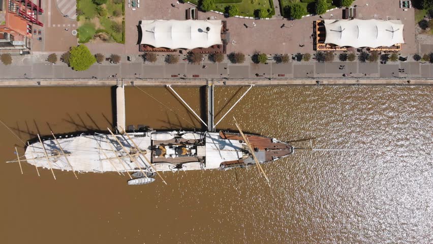 Buenos Aires, Argentina - November 21, Aerial drone view of historic museum boat ARA Uruguay park in Puerto Madero harbor on rio de la plata river.