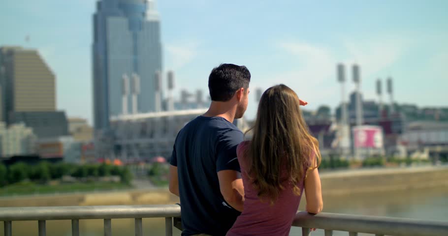 Couple Looks Out Over Bridge, Cincinatti Skyline