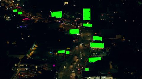 Green screen with track points aerial view of city traffic and billboards on Sunset Boulevard on a clear night in Los Angeles, California. Shot on 4K RED camera.