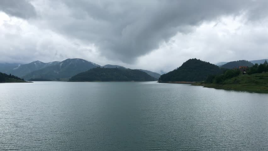 Landscape view on Zaovine lake and mountains in cloudy moody day
