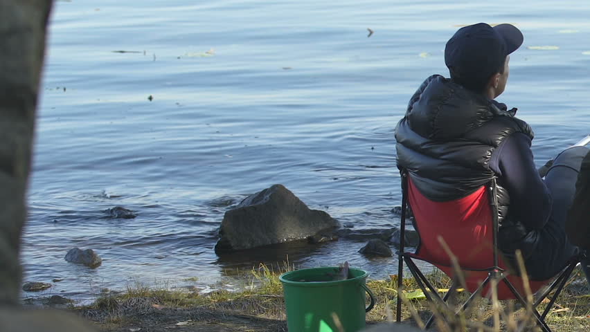 Inexperienced men sleeping during morning fishing, friends relaxing outdoor