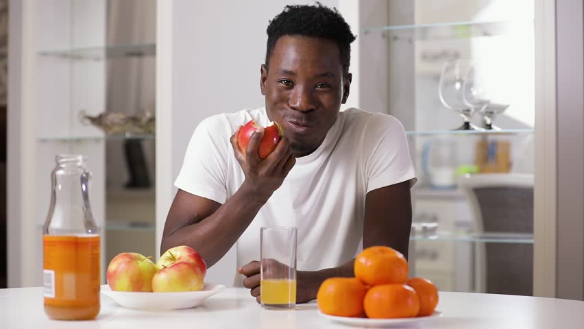 Black Man Eating Apple On Stock Footage Video (100% Royalty-free)  1020787081 | Shutterstock