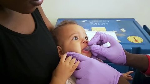 Jinja, Uganda - 08 12 2018: Jinja, Uganda, August 2018 - baby being vaccinated at a medical clinic.