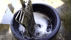 Slow Motion of black bucket with cleaning old mop for cleaning. - Powered by Shutterstock - Get 15% off with code: PIKWIZARD15
