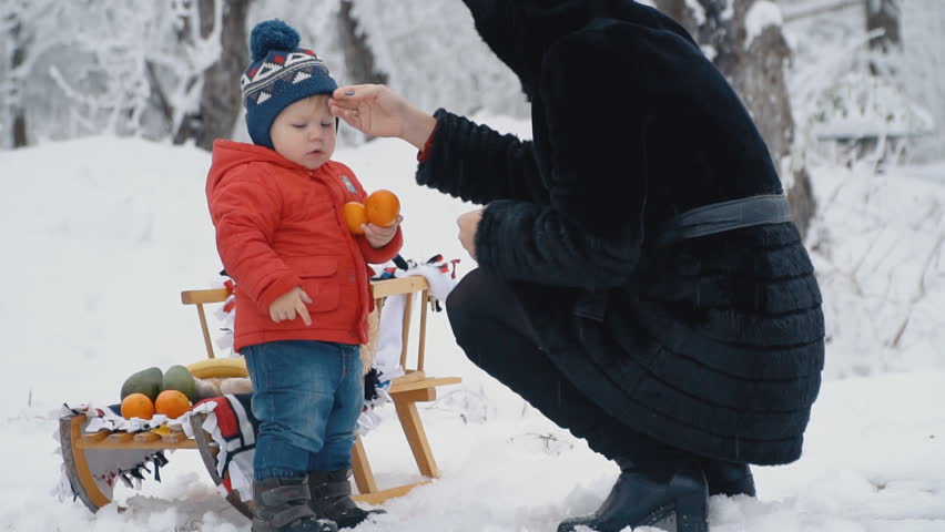 little boy with sled