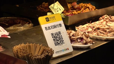 SHENZHEN, CHINA - CIRCA NOVEMBER 2018 : QR CODE to make a payment via smart phone.  At a shop in DONG MEN FOOD STREET in Laojie area.