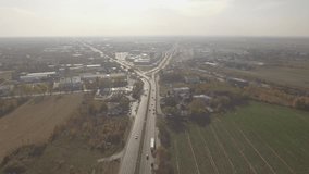 Aerial view of the motorway in the village of Yankee a suburb of Warsaw. Poland. 4K video