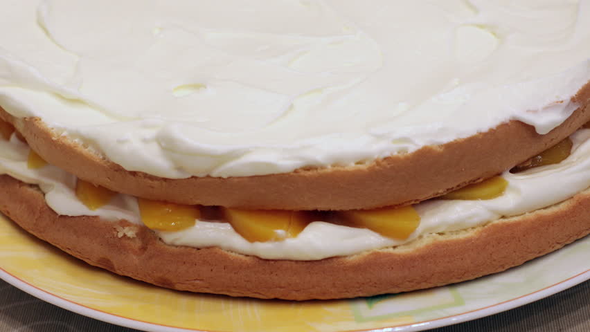 Making Peach Layer Cake. Cook at home, make a cake.