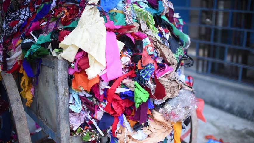 A pile of waste clothes thrown in trash, it could be used in recycling and given to poor Royalty-Free Stock Footage #1020816226
