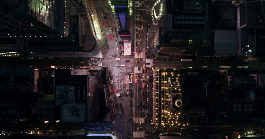 Top down aerial view of busy streets and summer nightlife in Times Square, New York City. Shot on 4k RED camera