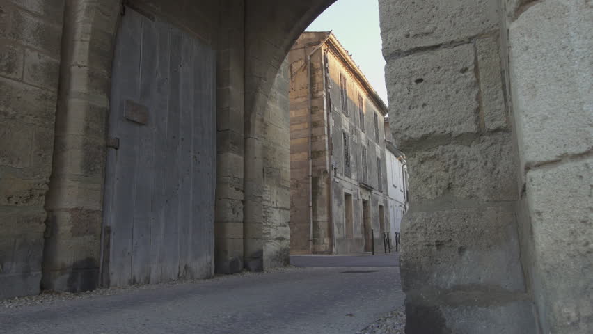 Fortress town of Aigues Mortes in southern France - panning shot (slide) of outer walls and gate