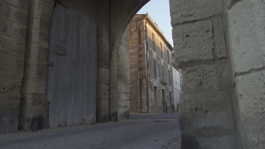 Fortress town of Aigues Mortes in southern France - panning shot (slide) of outer walls and gate