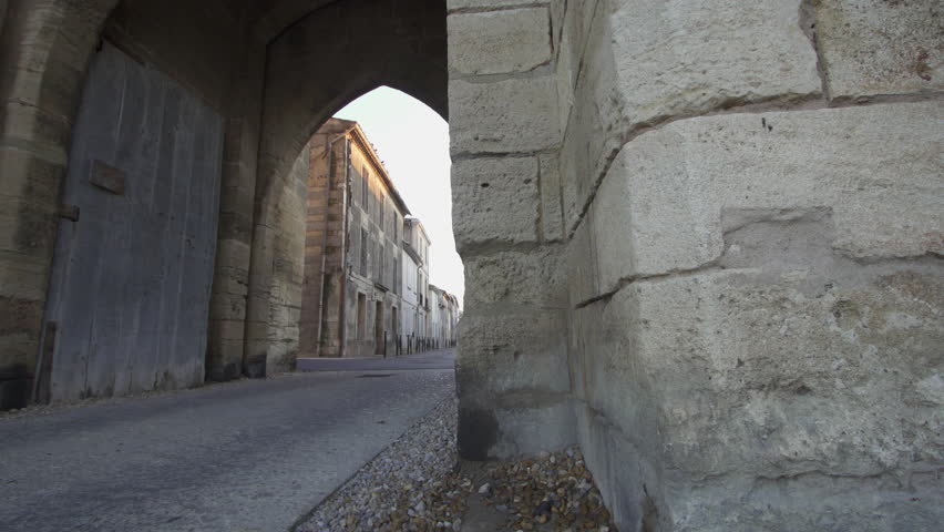 Fortress town of Aigues Mortes in southern France - panning shot (slide) of outer walls and gate