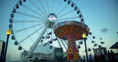 Chicago, Illinois / United States - September 5 2018: Swings Ride & Ferris Wheel, Navy Pier, Chicago