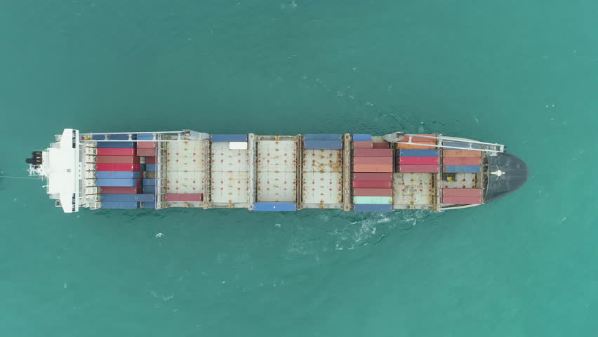 Container Ship in the Sea. Aerial Vertical Top-Down View. Drone is Flying Sideways | Shutterstock HD Video #1020826594