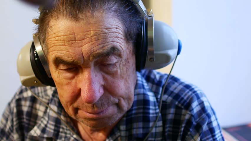 Hearing test. Man with headsets listen to a noise. Occupational health and safety for audiometric testing