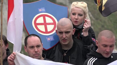 Dover, United Kingdom (UK) - 04 02 2016: Nazi skinheads hold a white power symbol plaque
