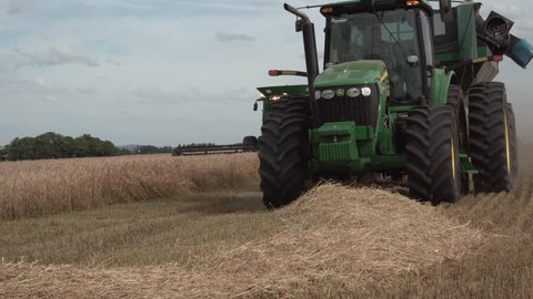 Castro, Brazil - 28 November 2018: Combine harvester John Deere at work in field of wheat