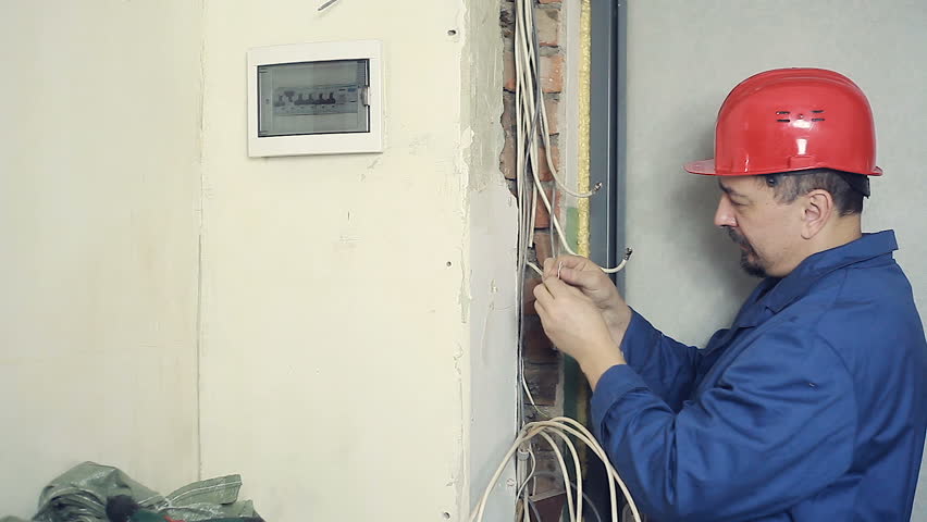 Male electrician performs installation work Royalty-Free Stock Footage #1020888715