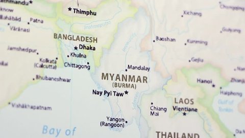Myanmar on a political map of the world. Video defocuses showing and hiding the map.