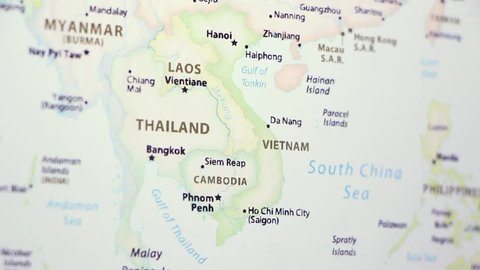 Vietnam Laos on a political map of the world. Video defocuses showing and hiding the map.