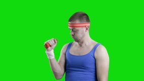 Funny and crazy sportsman with a dumbbell isolated on green background. Chroma key