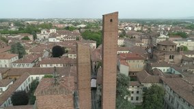 Aerial footage drone view of monuments and skyline of Pavia, beautiful old city town in Italy // no video editing