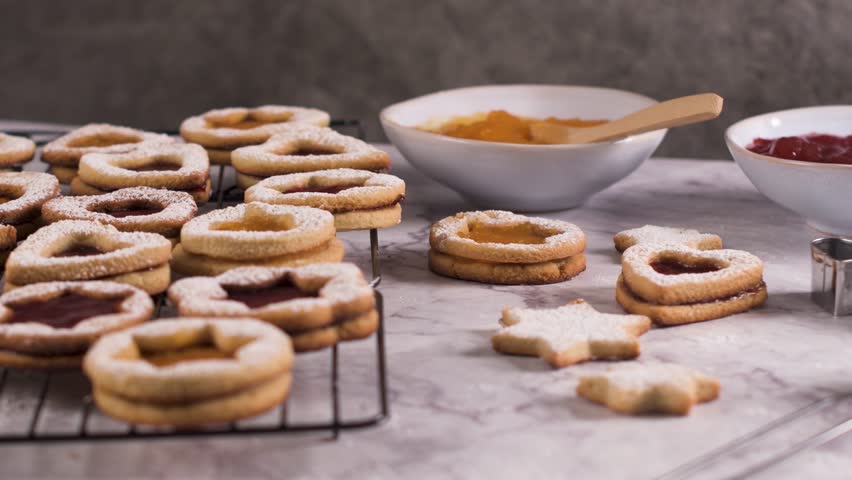 Homebaked Christmas Cookies With fruit Jam filling and Icing Sugar.