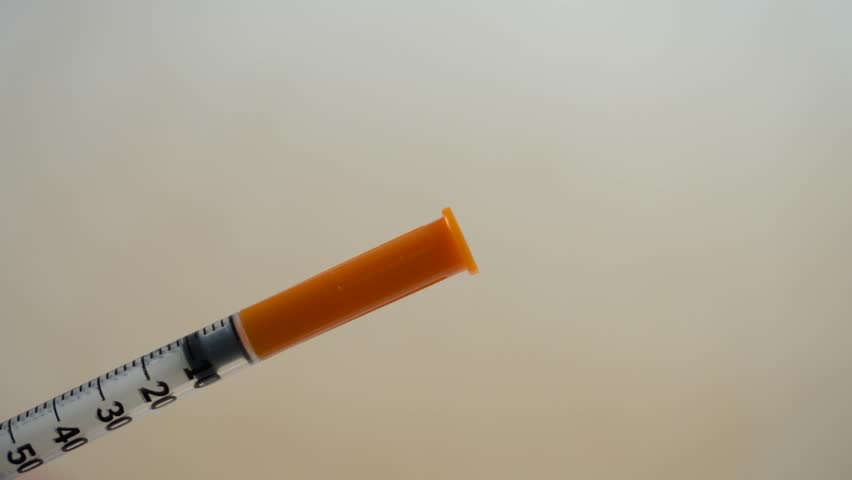 Medical hands and syringes are being vaccinated to patients in the laboratory. Coronavirus vaccine, omicron. Covid-19 vaccination concept